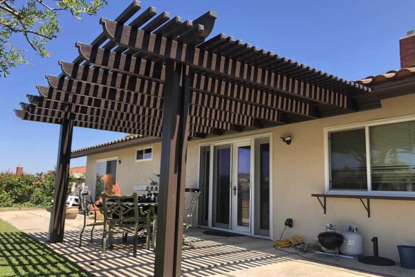 Alumawood patio cover installed on a San Diego home with a wood grain look